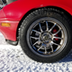 About an inch of wheel gap. Less, due to the already shredded fender. With an alignment and fender pull/roll I’d be able to soak up bumps that took the lip of the wheel all the way up to the current fender line. Can you say “long travel, short shock bodies?”